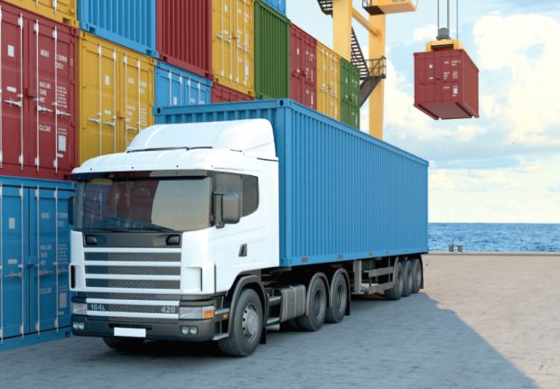 Road-truck-at-port-with-containers